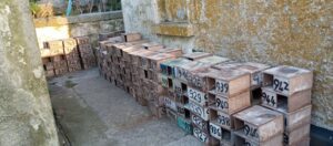 numbered-tern-boxes-stacked-against-wall